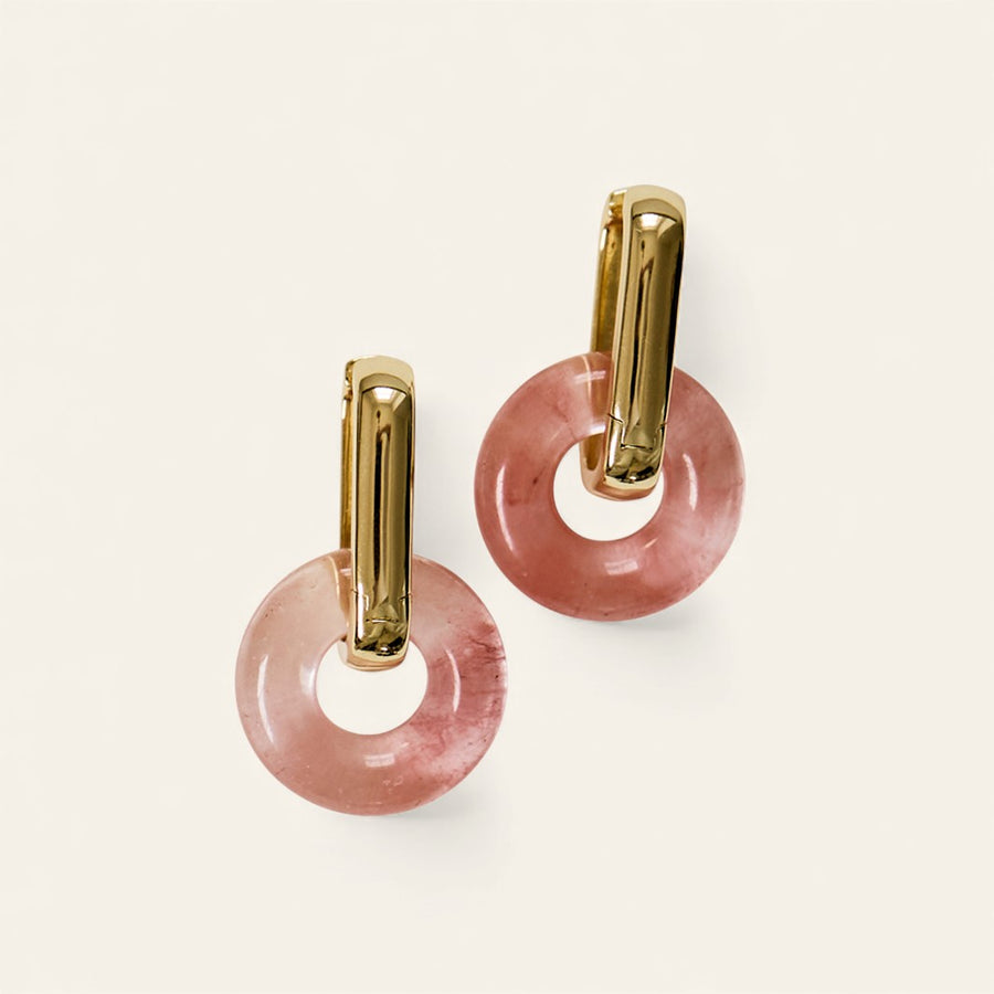 Gold plated sterling silver hoop earrings with round pink gemstone halos.