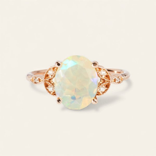 The Tri Diamond Oval Cut Stone Ring in Rose Gold
